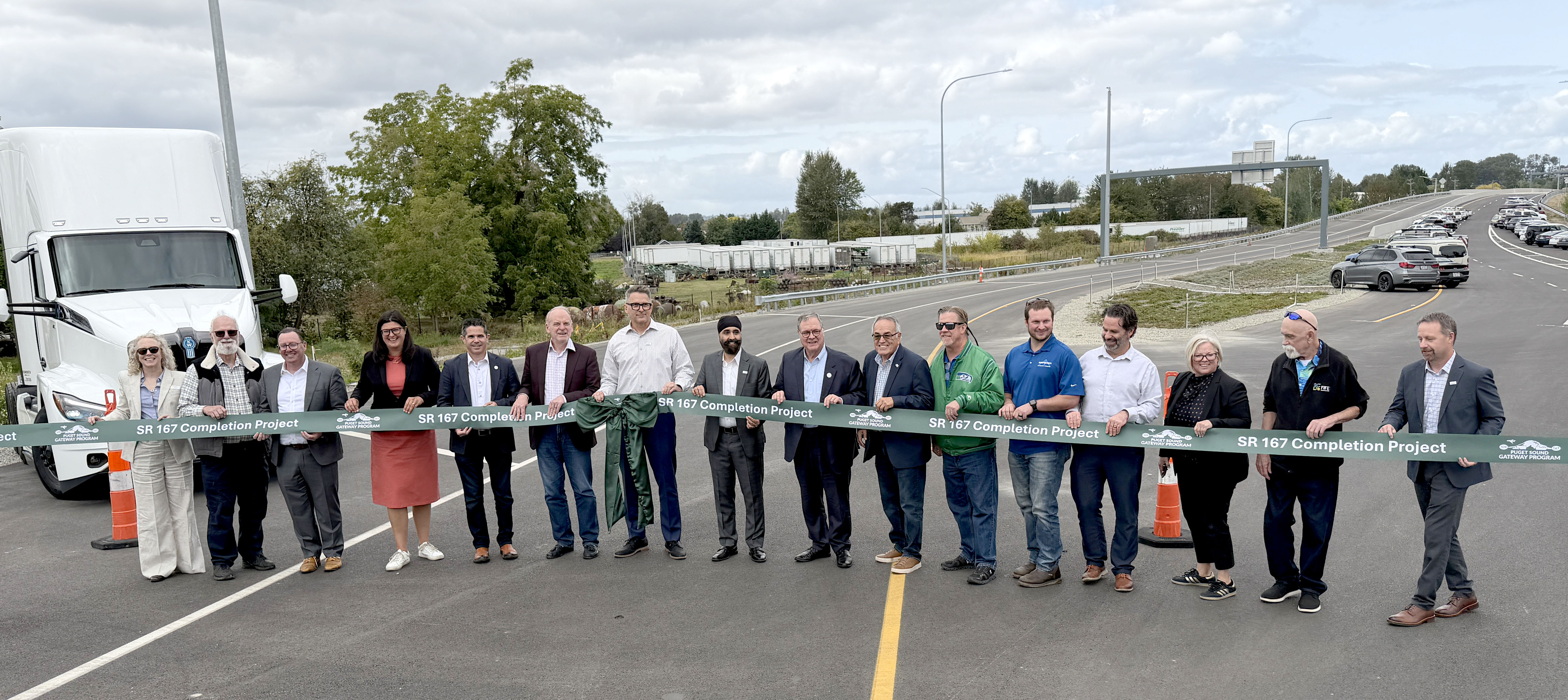 Community partners hold the ribbon at the SR167 Expressway Ribbon Cutting