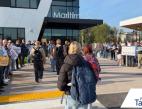 Thumbnail of students walking into the Maritime|253 skills center while a group of adults cheer and hold signs.